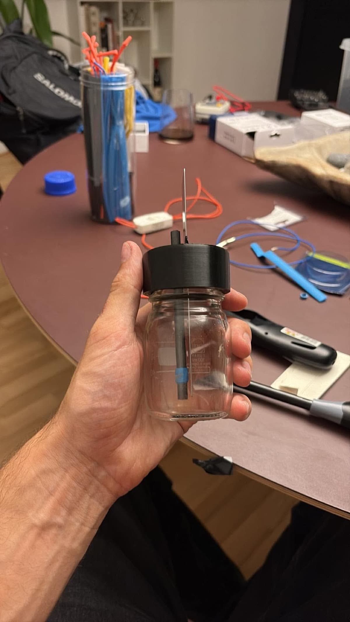 MudBottle prototype held by hand